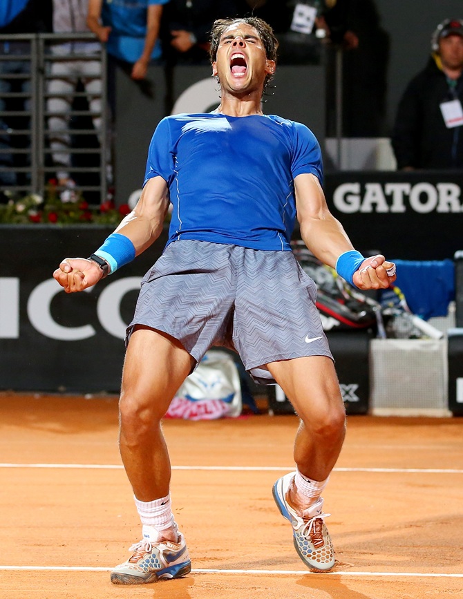 Rafael Nadal of Spain celebrates defeating Andy Murray of Great Britain