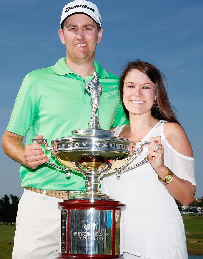 Brendon Todd,left, poses with his wife Rachel Todd holding the trophy after   his victory at the HP Byron Nelson Championship at the TPC Four Seasons Resort