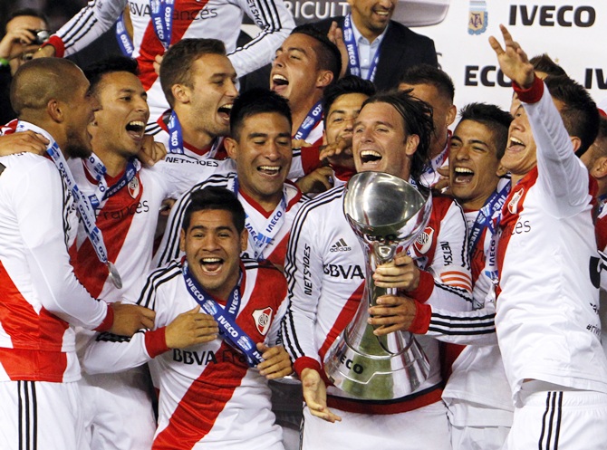 River Plate's players celebrate with the trophy after winning the Argentine first division soccer championship