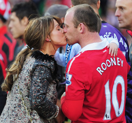 Coleen Rooney kisses husband Wayne