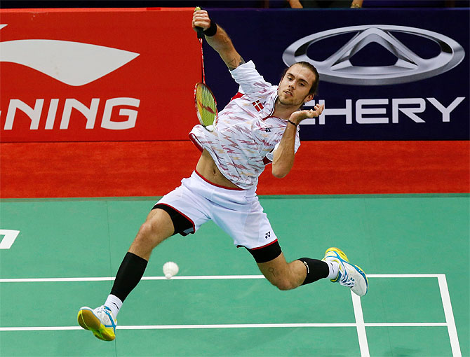 Denmark's Jan O Jorgensen returns a shot to Malaysia's Lee Chong Wei during their men's singles quarter-final match at the Thomas Cup badminton championship in New Delhi on Thursday