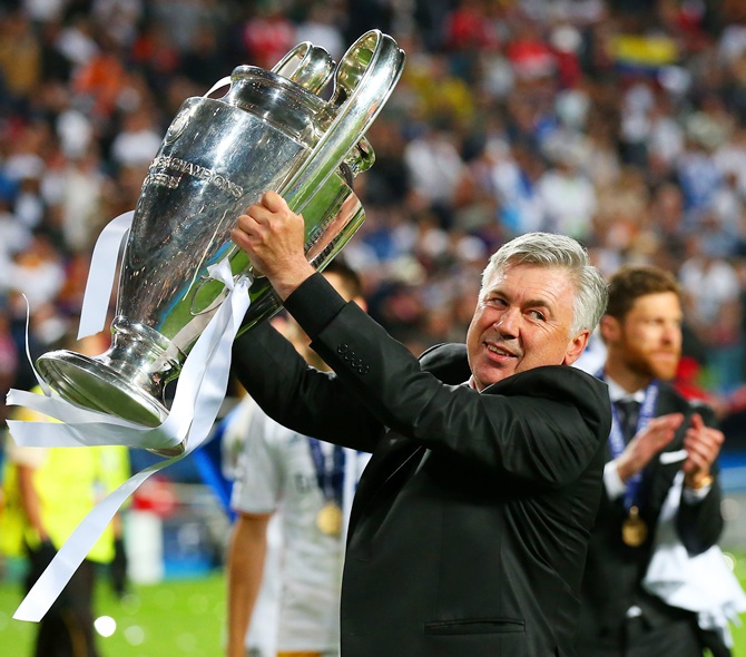 Head Coach, Carlo Ancelotti of Real Madrid celebrates with the Champions League trophy