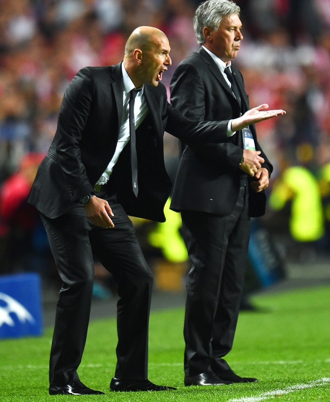 Head Coach, Carlo Ancelotti of Real Madrid looks on as Assistant coach Zinedine Zidane of Real Madrid shouts instructions