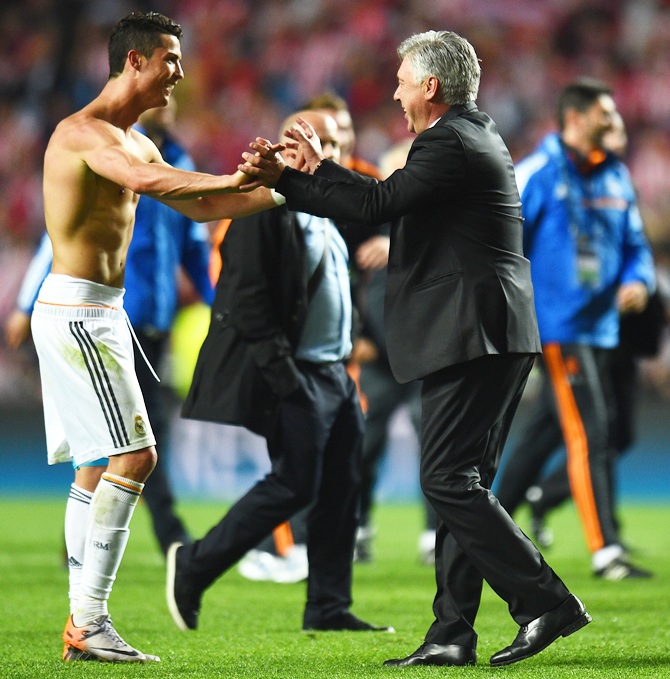 Cristiano Ronaldo of Real Madrid celebrates victory with Head Coach, Carlo Ancelotti