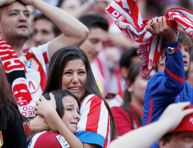 Atletico de Madrid fans react after the loss