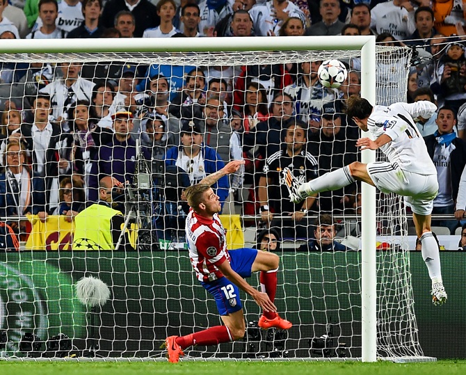 Gareth Bale of Real Madrid heads in their second goal during the UEFA Champions League Final