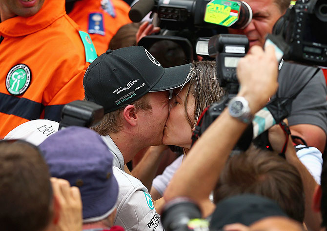 Nico Rosberg of Germany and Mercedes GP kisses his girlfriend Vivian Sibold following his victory during the Monaco Formula One Grand Prix on Sunday