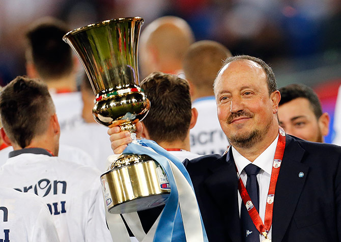 Napoli's coach Rafa Benitez holds the Italian Cup trophy