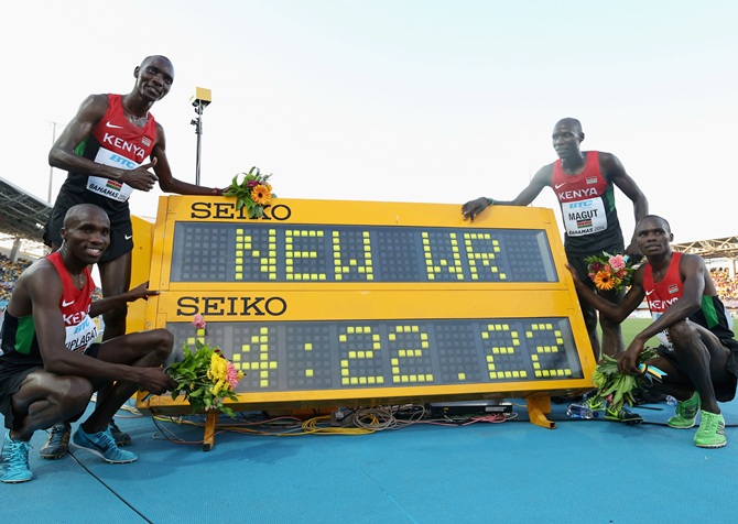 From left, Silas Kiplagat, Asbel Kiprop, James Kiplagat Magut and Collins Cheboi   of Kenya pose together after setting a new world record of 14:22.22 in the Men's 4x1500 metres relay final