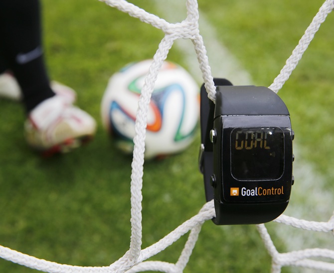 A GoalControl watch reads goal as a football rolls fully behind the goal line during a demonstration in the western German city of Aachen