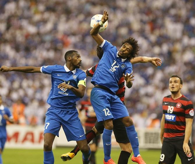 Nikolai Topor-Stanley of the Wanderers competes with Yasir Al Shahrani of Al Hilal