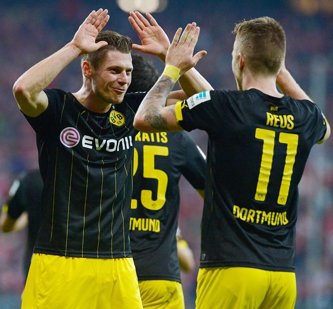 Marco Reus of Dortmund, right, celebrates