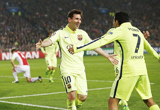 Barcelona's Lionel Messi celebrates his goal with teammate Pedro Rodriguez (R) during their Champions League Group F soccer match