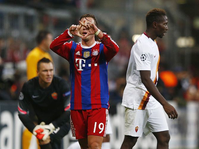 Bayern Munich's Mario Goetze gestures after scoring against AS Roma