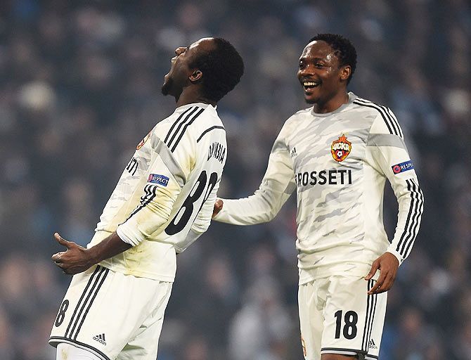 Seydou Doumbia of CSKA Moscow celebrates with Ahmed Musa (right) after scoring against Manchester City