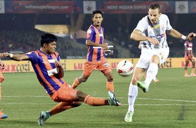 Atletico de Kolkata (white) and FC Pune City players in action during their ISL match in Kolkata on Friday