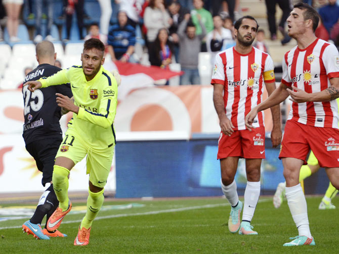 Barcelona's Neymar (2nd from left) celebrates his goal against Almeria during their La Liga match at Los Juegos Mediterraneos stadium in Almeria on Saturday