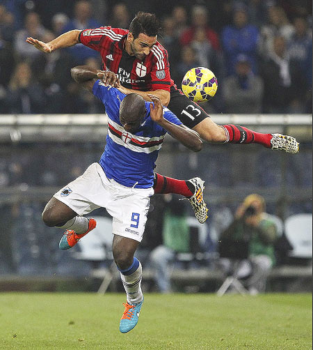 Stefano Chuka Okaka (left) of UC Sampdoria competes for the ball with Adil Rami (right) of AC Milan during their Serie A match