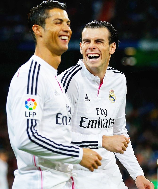 Cristiano Ronaldo, left, of Real Madrid CF joke swith his teammate Gareth Bale