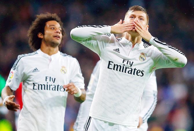 Toni Kroos of Real Madrid celebrates after scoring the third goal during their La Liga match against Rayo Vallecano at Estadio Santiago Bernabeu in Madrid on Saturday