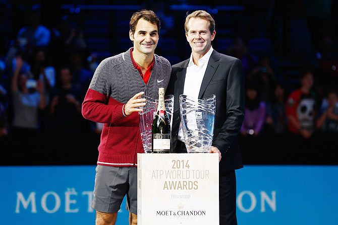 Roger Federer of Switzerland and coach Stefan Edberg with the Moet & Chandon Stefan Edberg Sportmanship Award and the Fans Favourite Award