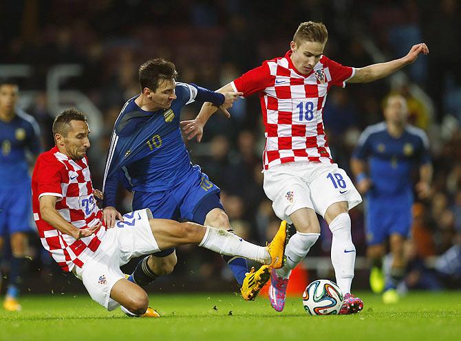 Argentina's Lionel Messi (centre) is challenged by Croatia's Marin Leovac (left) and Marko Rog on Wednesday