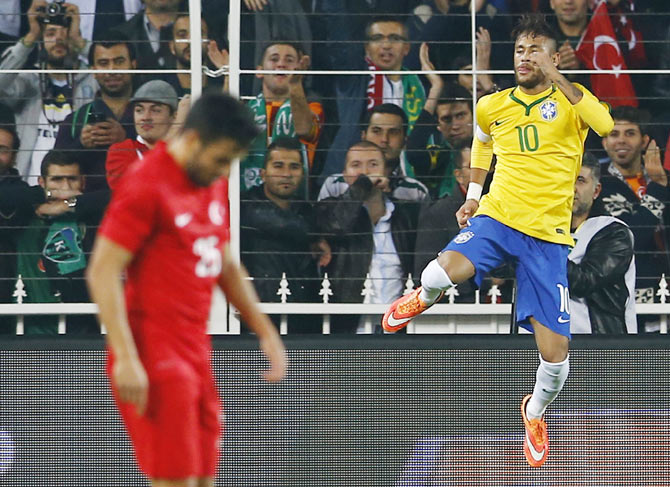 Neymar of Brazil (right) celebrates his second goal against Turkey during their international friendly at Sukru Saracoglu stadium in Istanbul on Wednesday