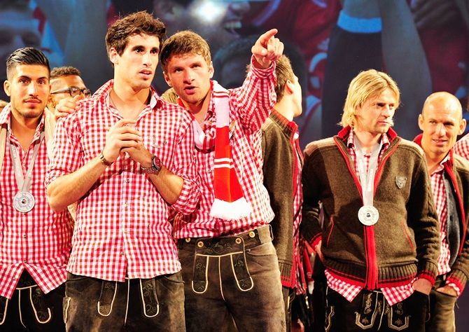 From left, Emre Can, Javier Martinez, Thomas Mueller, Anatoliy Tymoshchuk and Arjen Robben of Bayern Muenchen celebrate winning the German Championship