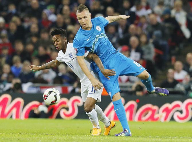 England's Raheem Sterling (left) challenges Slovenia's Jasmin Kurtic during their Euro 2016 Group E qualifying match on Saturday