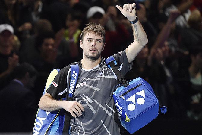 Stanislas Wawrinka of Switzerland reacts after losing his semi-final against compatriot Roger Federer 