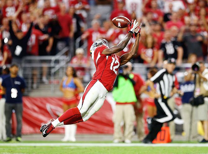 Arizona Cardinals wide receiver John Brown (12) catches a touchdown pass in the fourth quarter against the St. Louis Rams at University of Phoenix Stadium