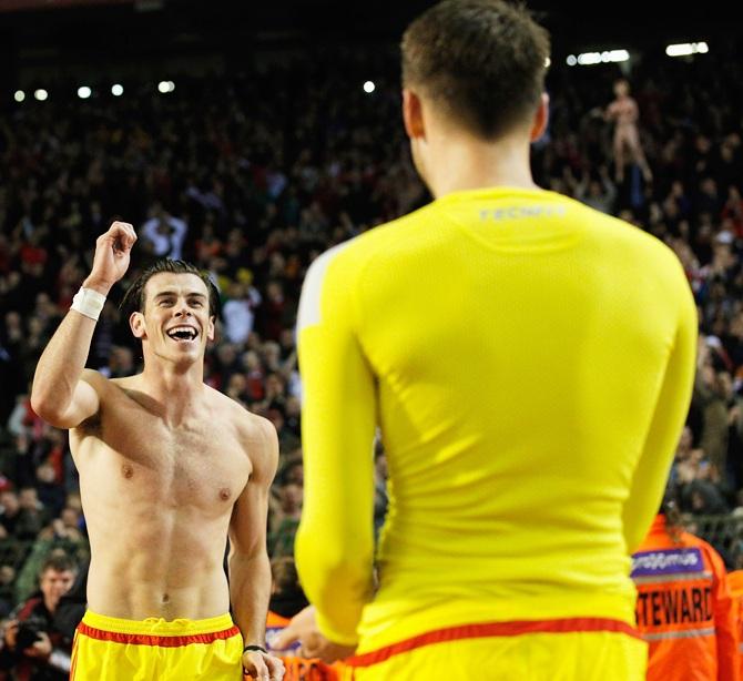 Gareth Bale and James Chester of Wales celebrate