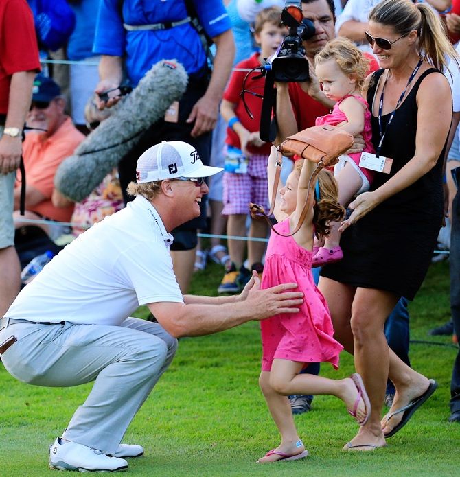 Charley Hoffman of the United States celebrates with his family