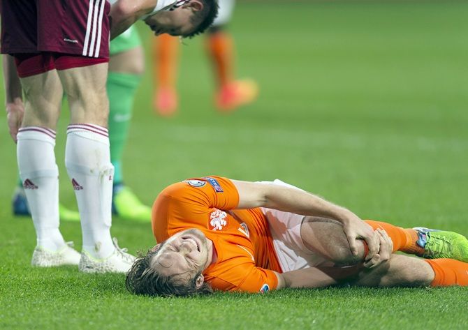 Daley Blind of the Netherlands lies injured