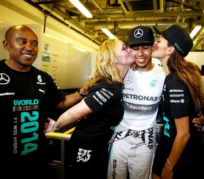 Lewis Hamilton of Great Britain and Mercedes GP celebrates with his stepmother Linda   Hamilton and girlfriend Nicole Scherzinger