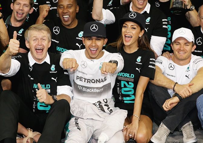 Lewis Hamilton of Great Britain and Mercedes GP celebrates with his girlfriend Nicole   Scherzinger and team including Nico Rosberg of Germany
