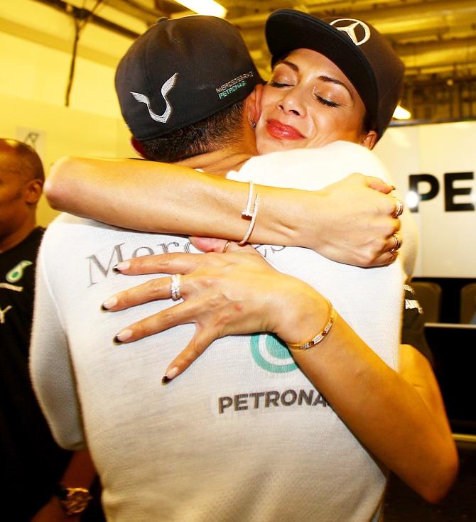 Lewis Hamilton of Great Britain and Mercedes GP celebrates with girlfriend Nicole Scherzinger