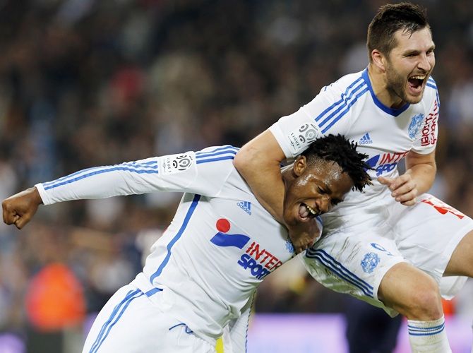 Olympique Marseille's Michy Batshuayi, left, celebrates with teammate Andre-Pierre Gignac after scoring against Girondins Bordeaux
