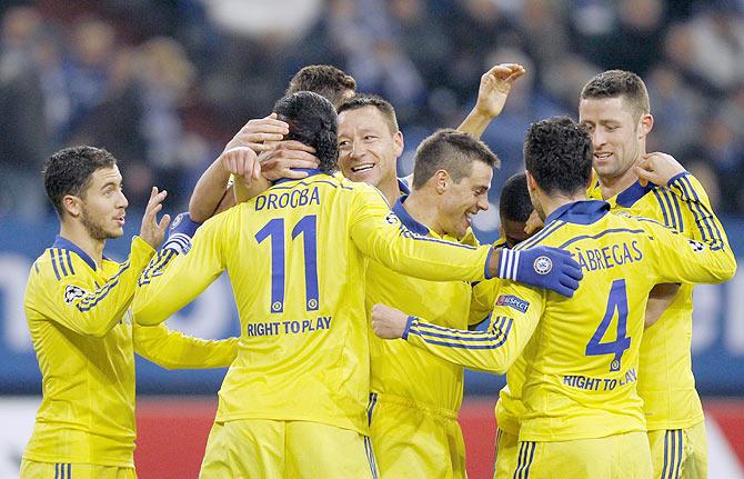 Chelsea's Didier Drogba celebrates with his teammates after scoring against Schalke 04 during their Champions League Group G match in Gelsenkirchen, Germany on Tuesday