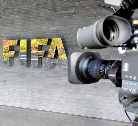 A camera is seen by the FIFA logo outside the FIFA headquarters