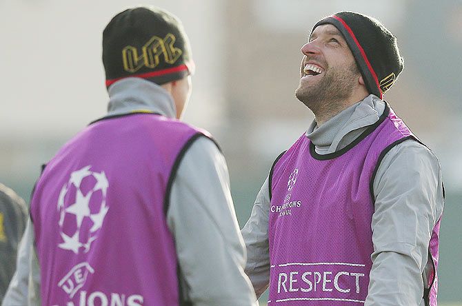 Liverpool's Rickie Lambert (right) laughs during a training session at the club's Melwood training complex in Liverpool on Tuesday