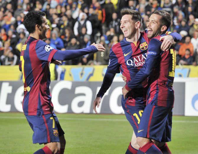 Barcelona's Lionel Messi (centre) celebrates with teammates after scoring against APOEL Nicosia during their Champions League Group F match at GSP Stadium in Nicosia in Cyprus on Tuesday