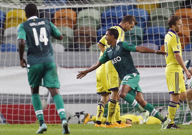 Sporting's Nani (centre) celebrates his goal against Maribor during their Champions League Group G soccer match at Alvalade stadium in Lisbon on Tuesday