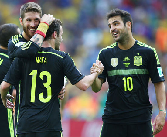 Spain's Sergio Ramos (left) celebrates with Juan Mata and Cesc Fabregas