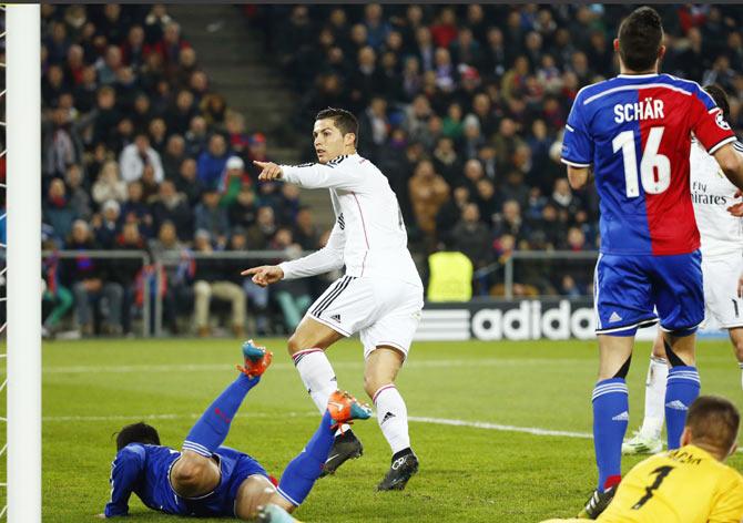 Real Madrid's Cristiano Ronaldo (centre) celebrates after scoring a goal during their Champions League Group B soccer match against FC Basel on Wednesday