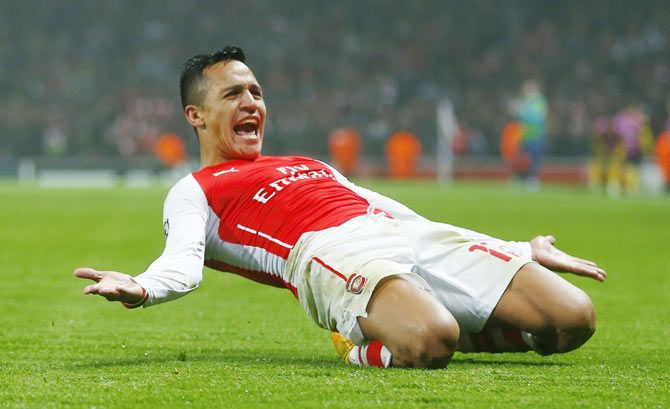 Arsenal's Alexis Sanchez celebrates after scoring a goal against Borussia Dortmund during their Champions League group D soccer match in London on Wednesday