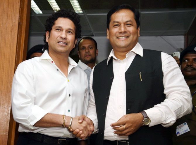 Sports minister Sarbananda Sonowal, right, with Sachin Tendulkar
