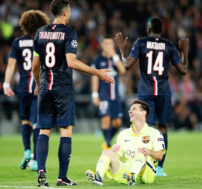 Thiago Motta of PSG fouls Lionel Messi