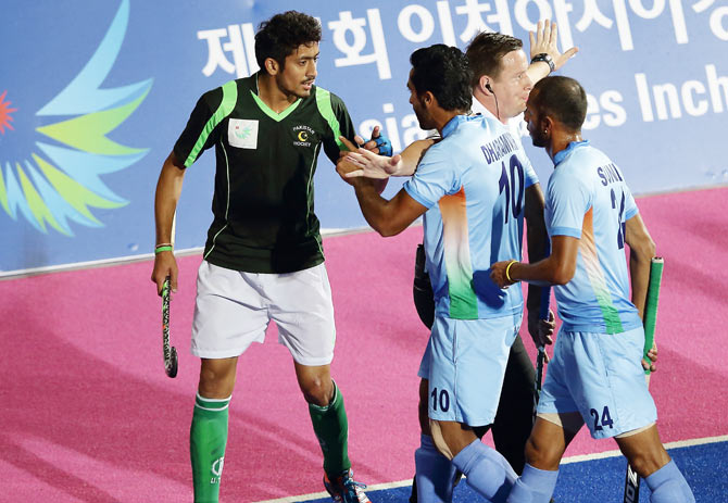 India and Pakistan players get into a heated discussion during their Asian Games final on Thursday