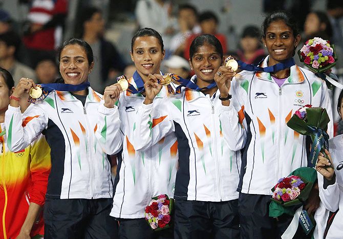 India's gold medallists Pawar Priyanka, Lukka Tintu, Kaur Mandeep and Poovamma Raju Machettira pose